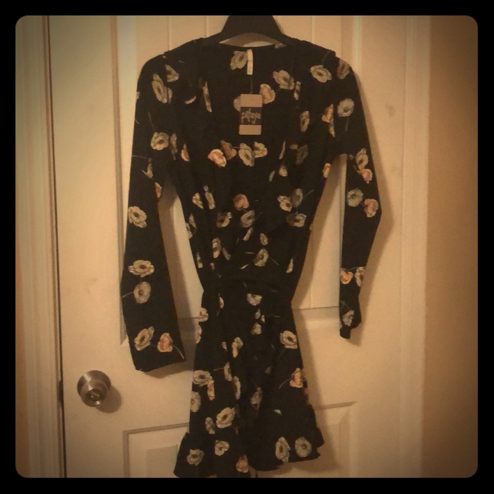 Black wrap dress with tan tinted floral print.